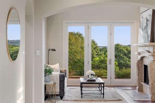 Living area with plenty of natural light and wood finished floors | Image 8