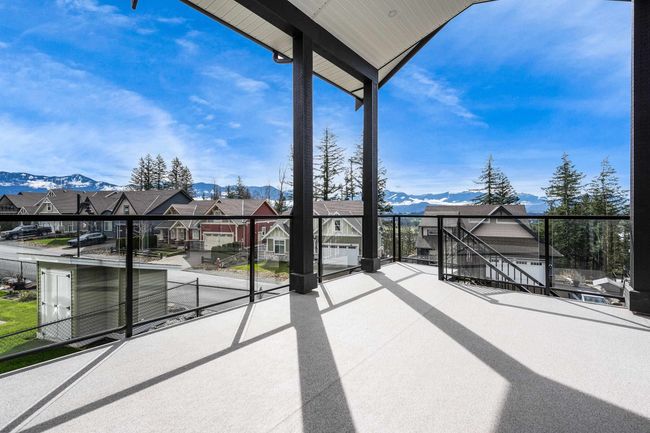 View of patio featuring a balcony, a residential view, and a mountain view | Image 20
