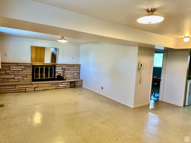Inviting family room with a fireplace and easy access to backyard | Image 17