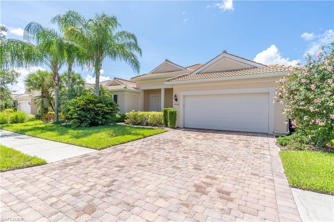 View of front facade featuring a garage and a front yard | Image 4