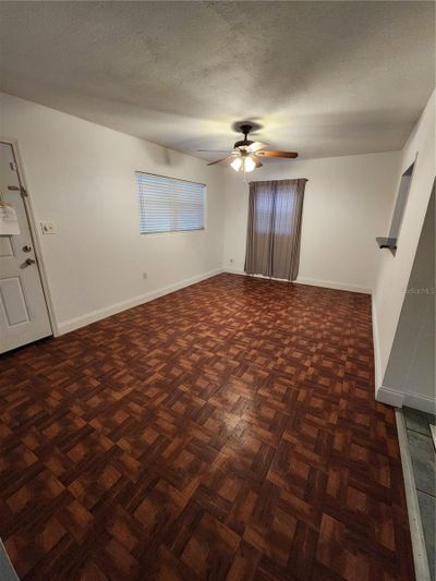 Another view of the living room/Family room towards the front entry | Image 3