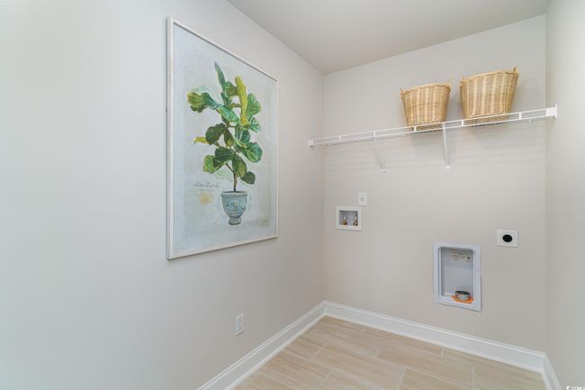 Clothes washing area with washer hookup, laundry area, baseboards, and hookup for an electric dryer | Image 23