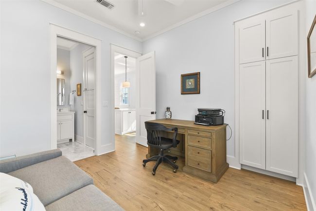Additional view of guest bedroom with built-in cabinetry and direct bath access. | Image 21