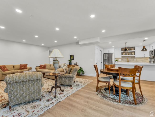 Living room featuring light wood finished floors, recessed lighting, and baseboards | Image 33