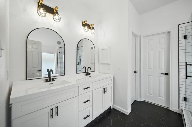 Full bath with double vanity and tile patterned flooring | Image 14