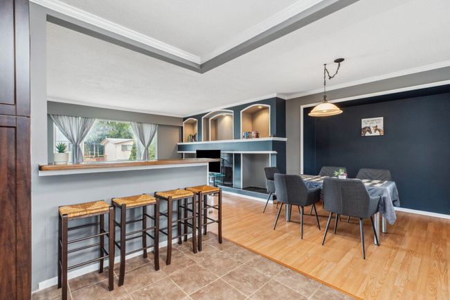 Interior space with baseboards, crown molding, and wood finished floors | Image 10
