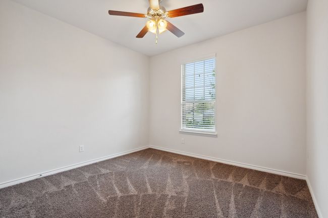 Unfurnished room with carpet floors and a ceiling fan | Image 23