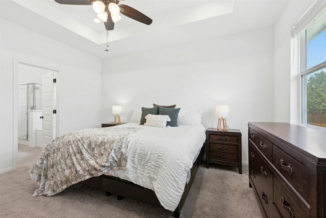 Primary bedroom with tray ceiling | Image 10