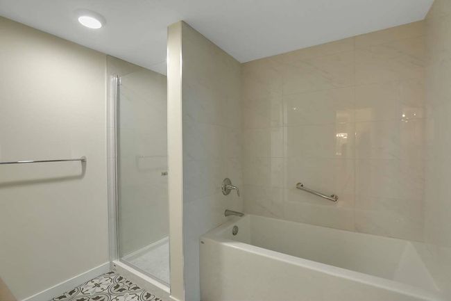 Bathroom with a shower and a tub to relax in | Image 26
