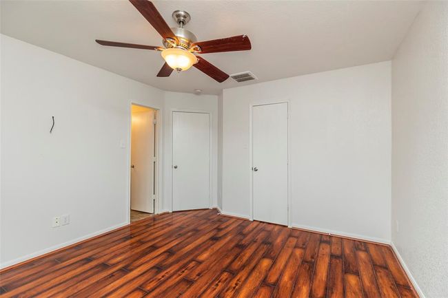 Primary Bedroom. Spacious and serene main bedroom perfect for rest and relaxation. | Image 11