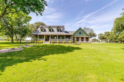 View of front of property featuring a front lawn and covered porch | Image 2