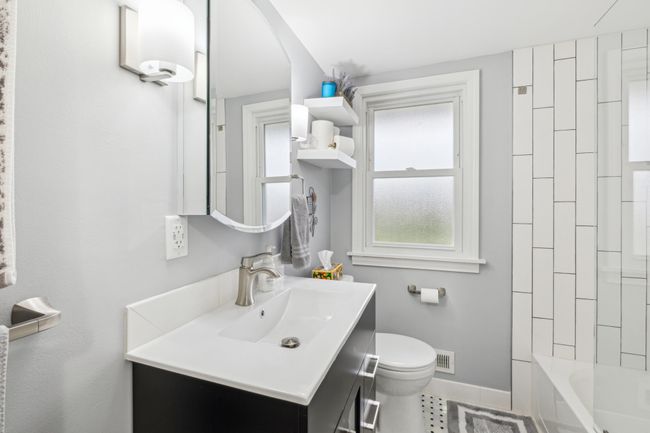 Main level bath with ceramic floors and subway tile shower | Image 10