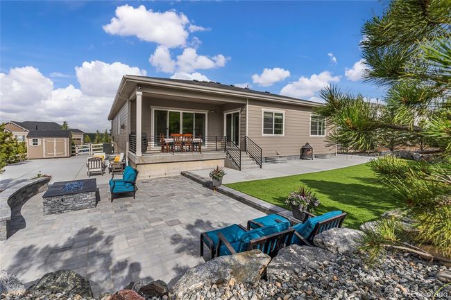 Belgard paver entertaining area with built-in 72"fireplace and custom bench and 2 additional gas lines. | Image 46