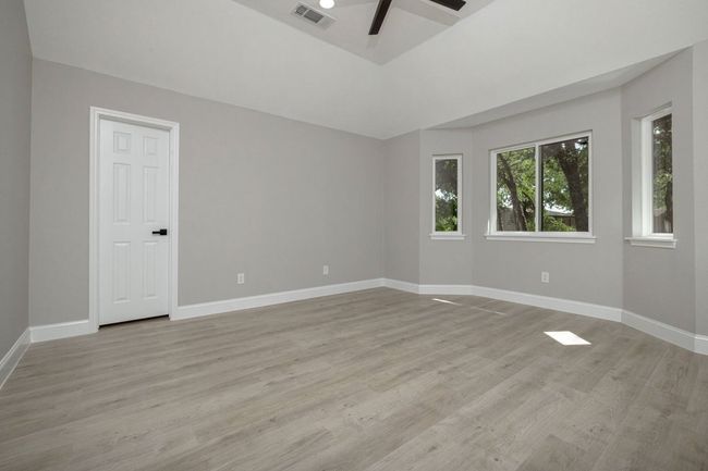 Spare room with a ceiling fan and light wood-style flooring | Image 28