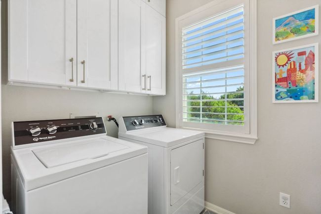 The in home laundry room is conveniently located upstairs alongside the bedrooms. | Image 29
