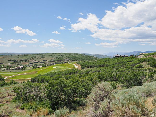 Bird's eye view of a golf club and mountains | Image 6