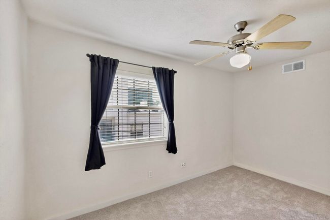 Unfurnished room with carpet and a ceiling fan | Image 32