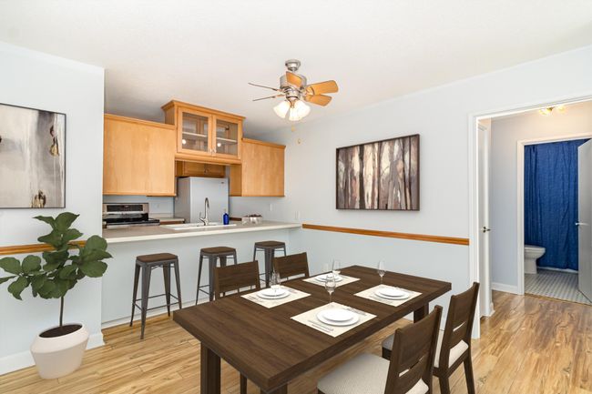 Dining area/breakfast bar facing the kitchen Virtually Staged | Image 5