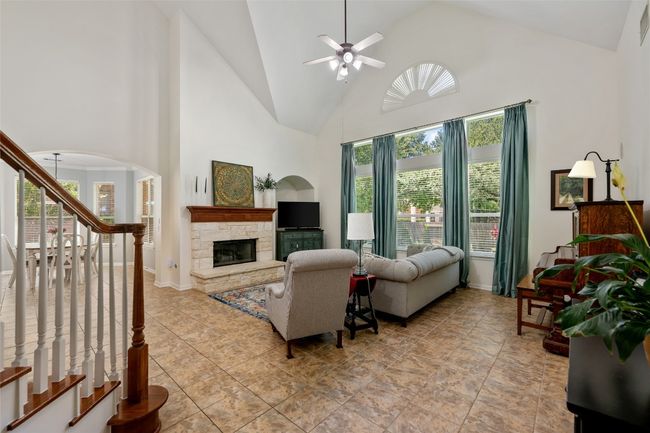 Follow the entryway to the back of the home to the living room. | Image 7