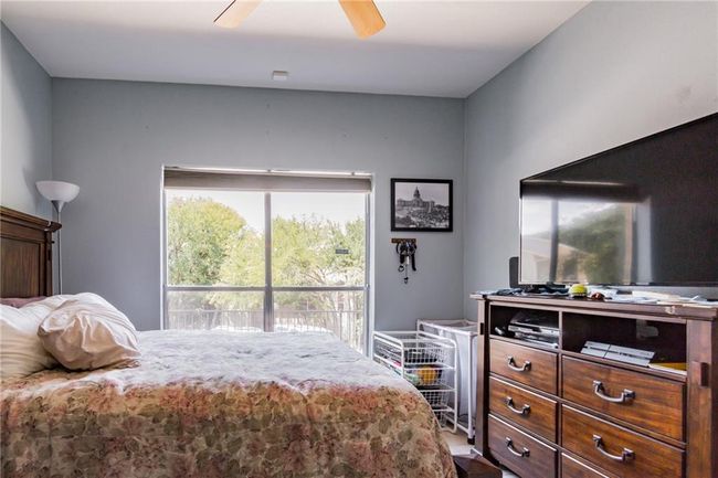Bedroom with a ceiling fan | Image 22