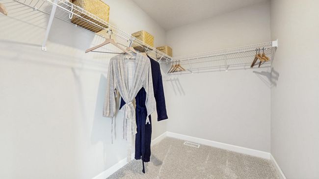 (Photo of a model home, actual features may vary) This owner’s suite features an incredible walk-in closet. | Image 12