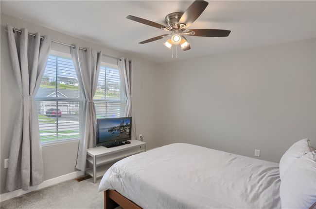 Left entry is this room with double windows for tons of lighting and a walk in close. | Image 16