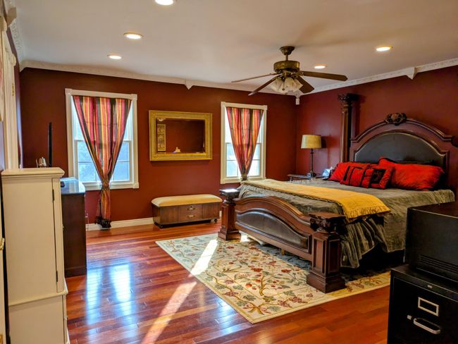 Main House Primary Bedroom with Lots of Natural Sunlight and Gleaming Hardwood Floors | Image 13