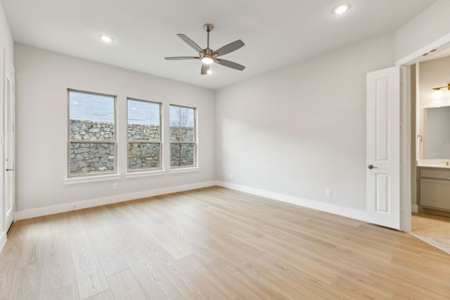 Unfurnished room with a ceiling fan, light wood-style flooring, and recessed lighting | Image 15