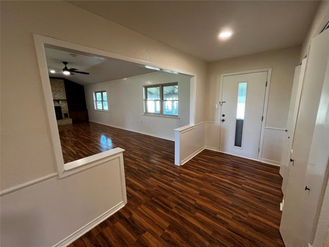 Welcome home! The front entry invites you into this charming, sprawling farmhouse! | Image 12