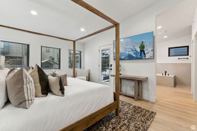 Bedroom with light hardwood / wood-style floors, access to outside, and vaulted ceiling | Image 19