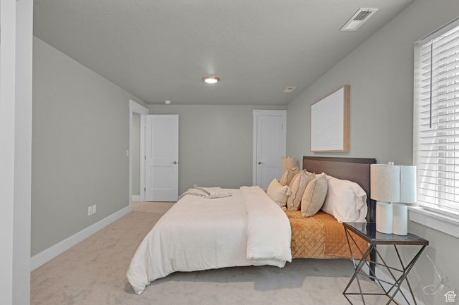 Bedroom with carpet floors and recessed lighting | Image 16