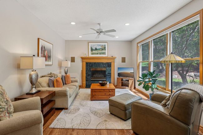 Nice family room, gas fire place and a wall of windows with views of the back yard | Image 9
