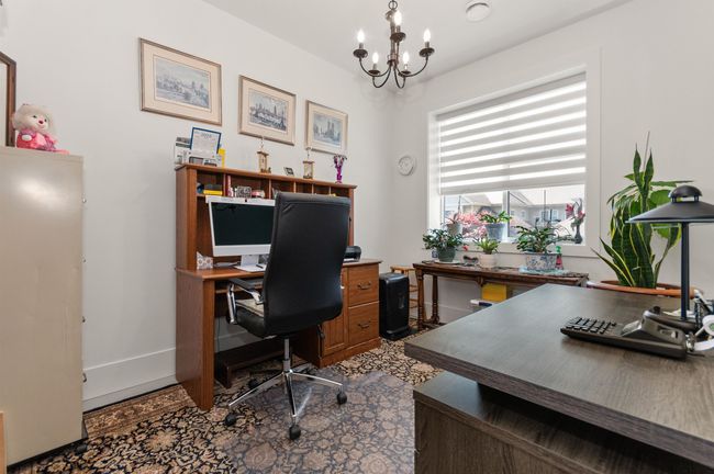 Office with a chandelier and baseboards | Image 36