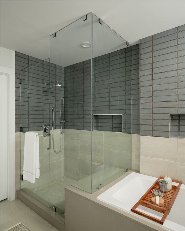 Bathroom featuring a bath, tile walls, a stall shower, and tile patterned flooring | Image 12