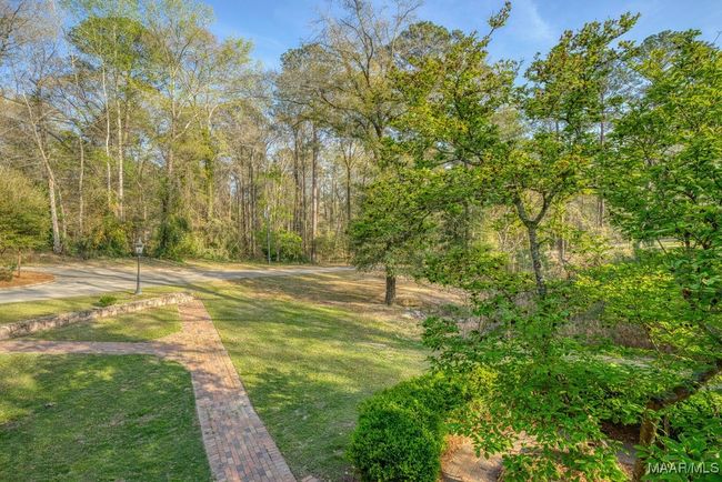 Brick sidewalks from the driveway to the front stairs and stone retaining walls | Image 12