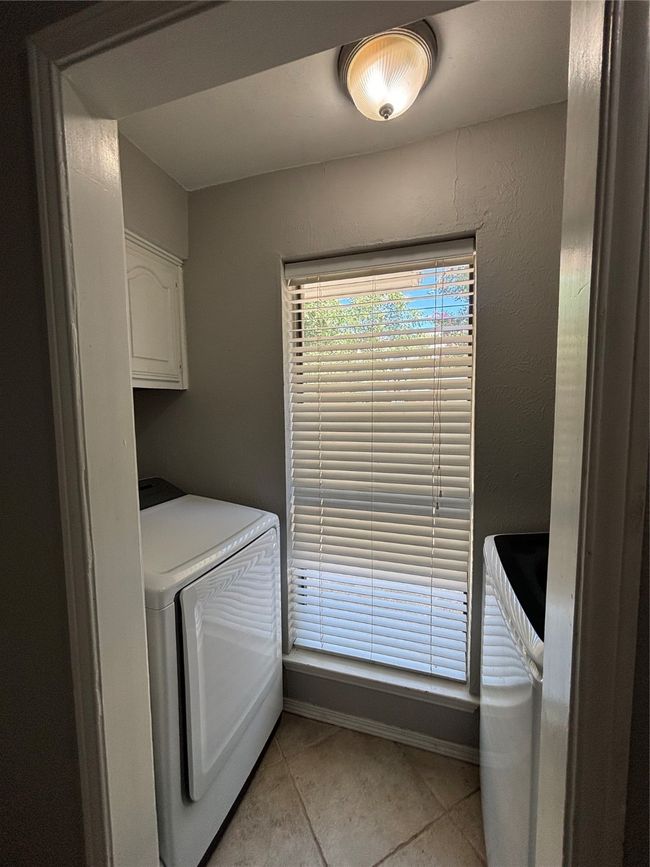 Laundry is off the garage but you don't have to walk through it to get to the garage! | Image 25