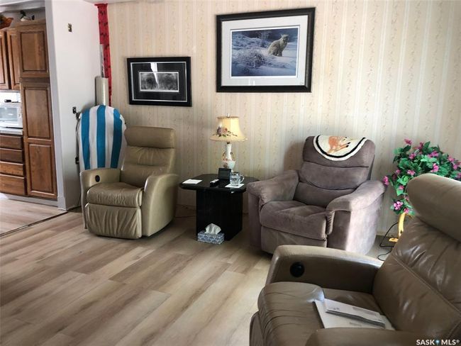Living area with light wood-style flooring | Image 24
