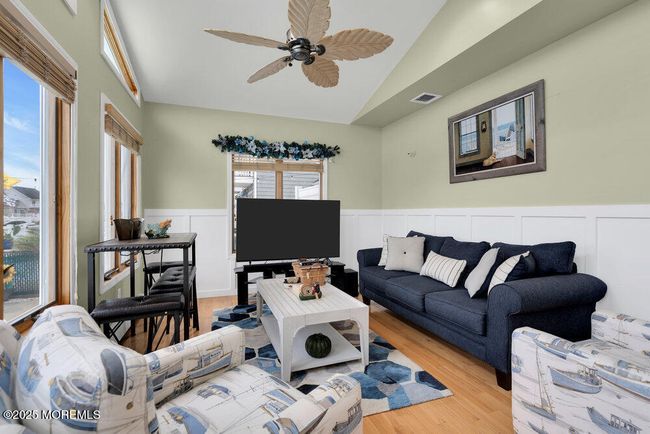 The family room overlooks the water | Image 16