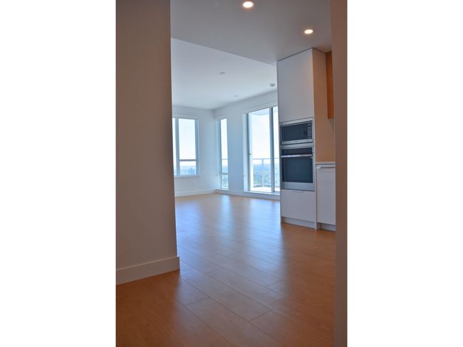Interior space featuring baseboards, recessed lighting, and light wood-style floors | Image 5