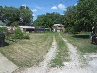 View of yard featuring an outdoor structure | Image 1