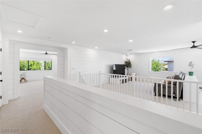 Corridor with light carpet and recessed lighting | Image 34