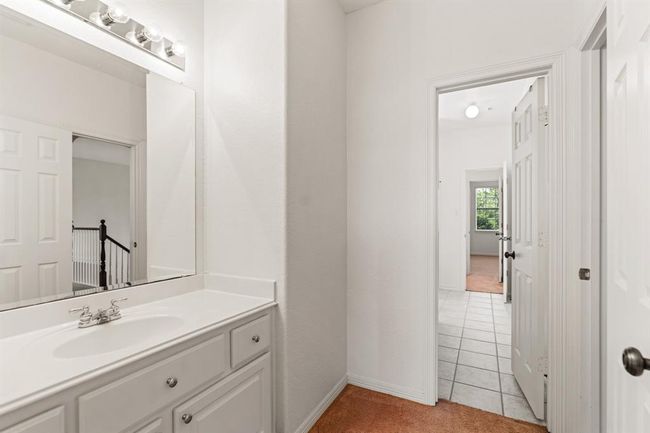 The opposite side of the Jack-and-Jill setup features a private vanity, with a shared tub-shower combo connecting the two sides in the center. | Image 26