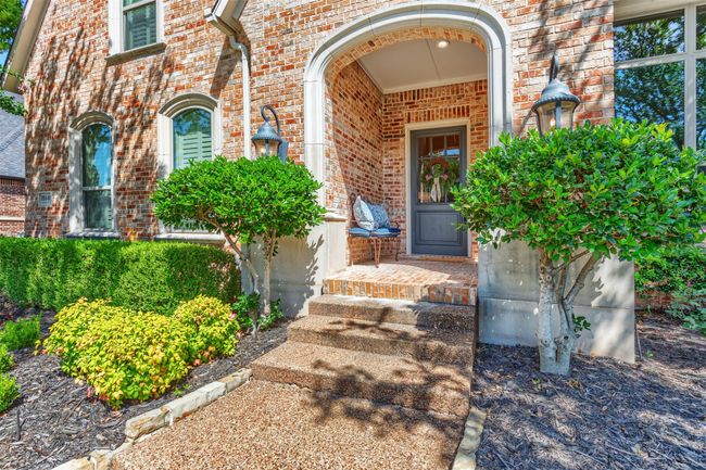 Doorway to property featuring brick siding | Image 38