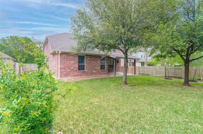 Back of property with brick siding and a patio | Image 31