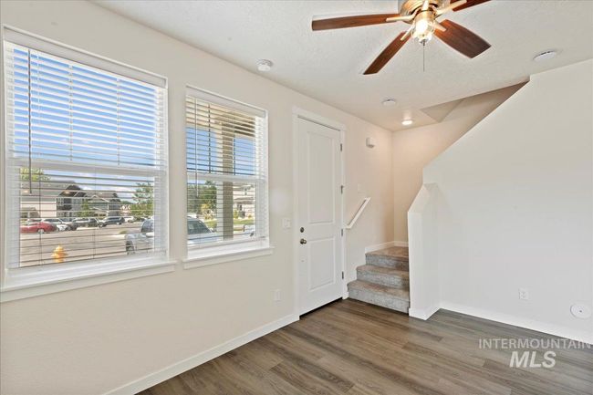 Foyer with wood finished floors, stairs, ceiling fan, and a textured ceiling | Image 19