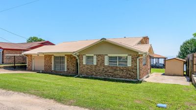 To the right of the home is a approximately 16x8 storage shed with a approximately 17x14 slab. | Image 3