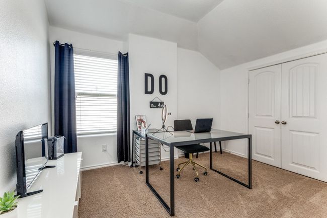 Home office featuring carpet and vaulted ceiling | Image 17