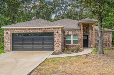 View of front of house featuring a garage | Image 1