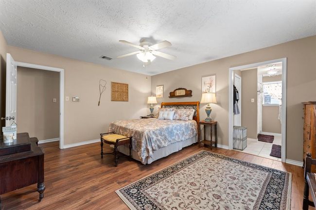 Primary bedroom down the hall. Primary has en-suite bathroom. | Image 14