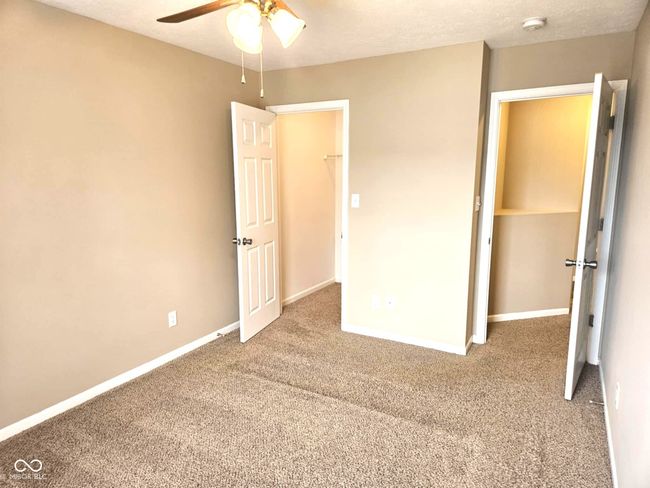 unfurnished bedroom with carpet and baseboards | Image 41